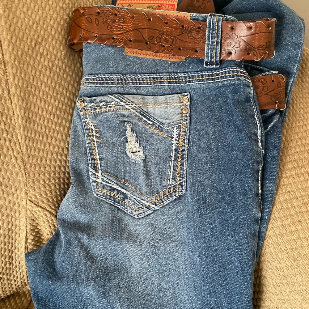 Pair of new mid rise jeans size 13 .